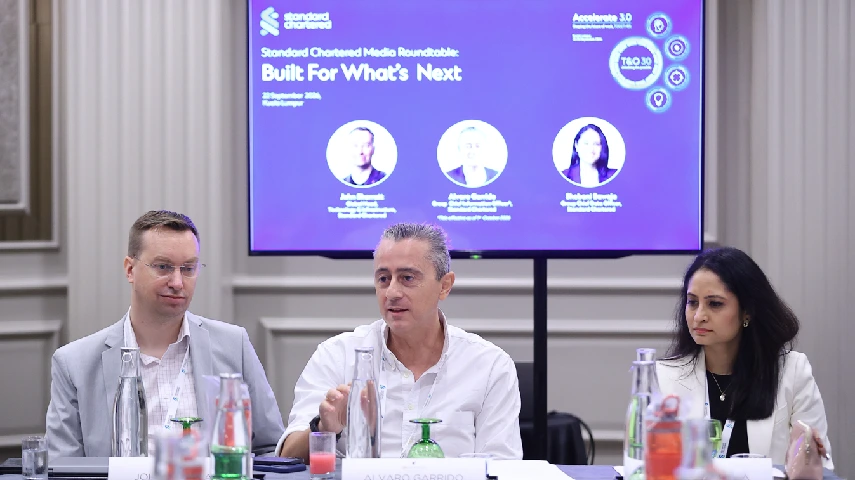 How is Standard Chartered building the controls needed to scale AI?